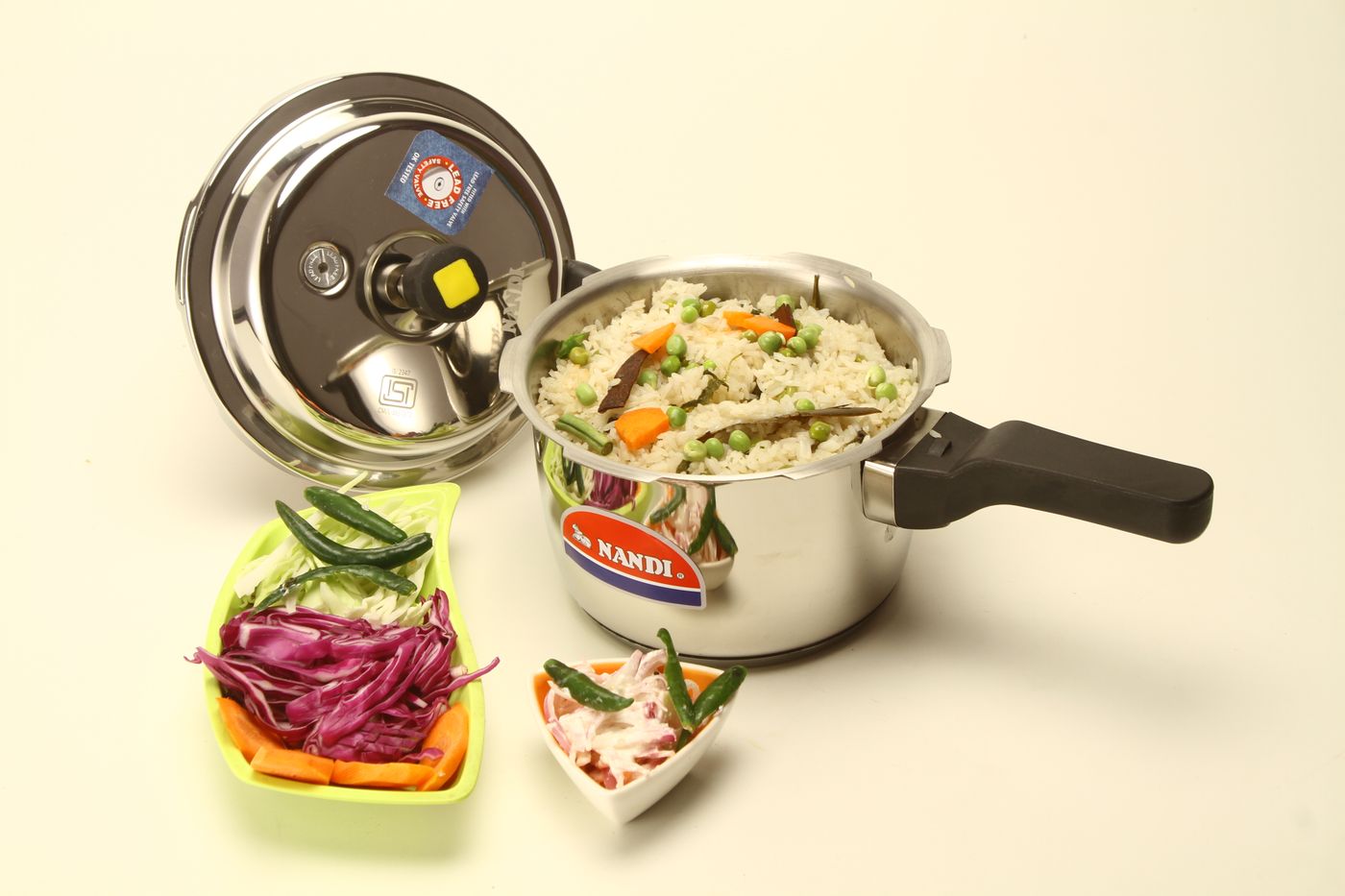 Open pressure cooker with a cooked rice meal