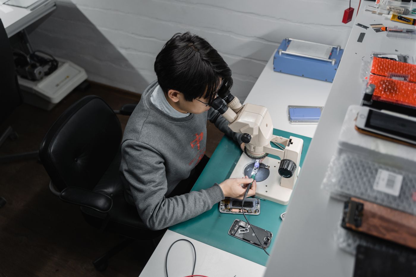 Technician inspecting smartphone