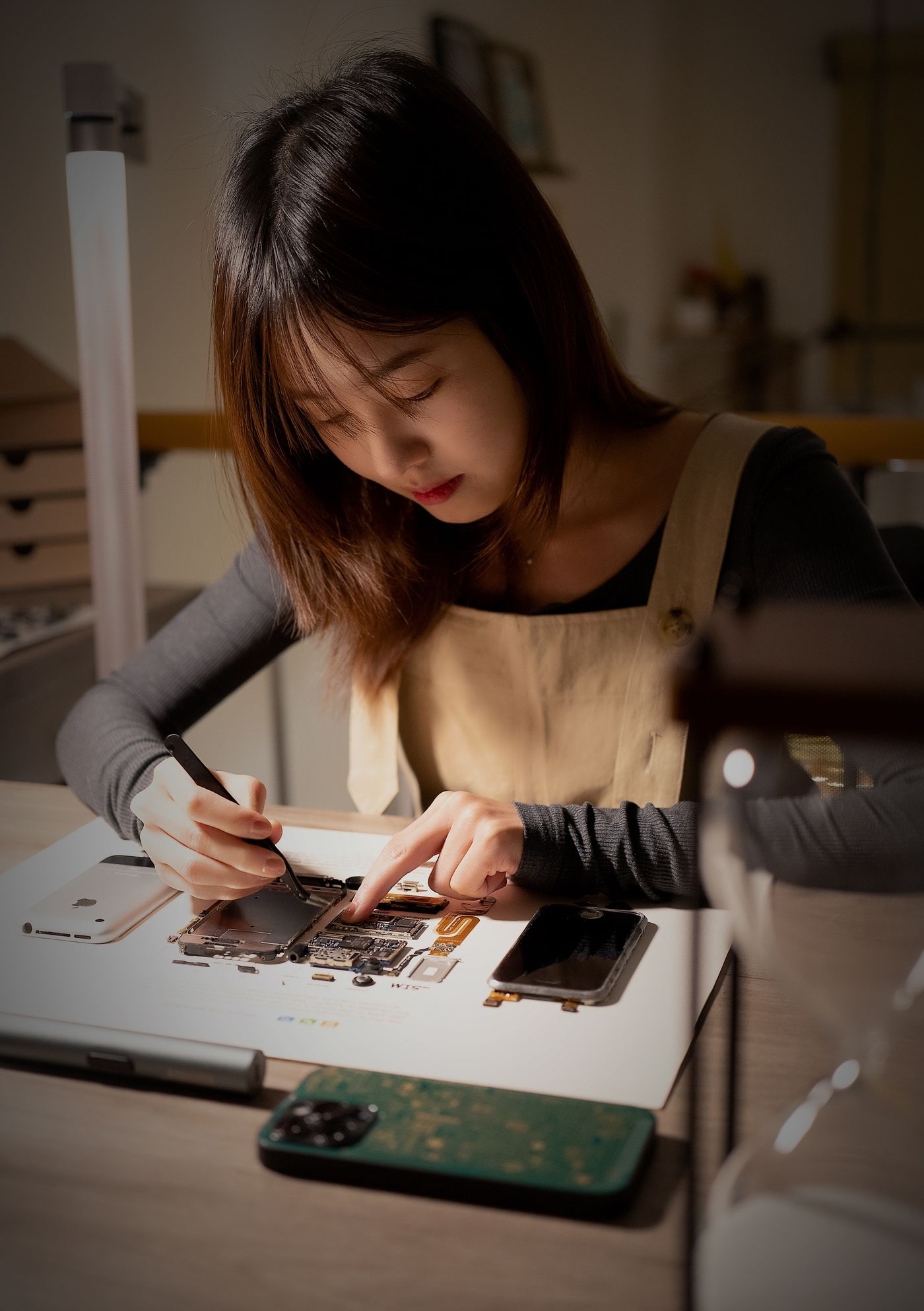 Electronics repair at workbench