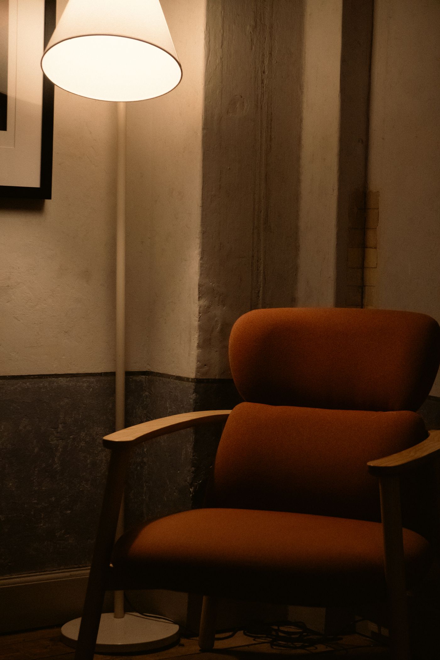 Reading armchair beside a lamp